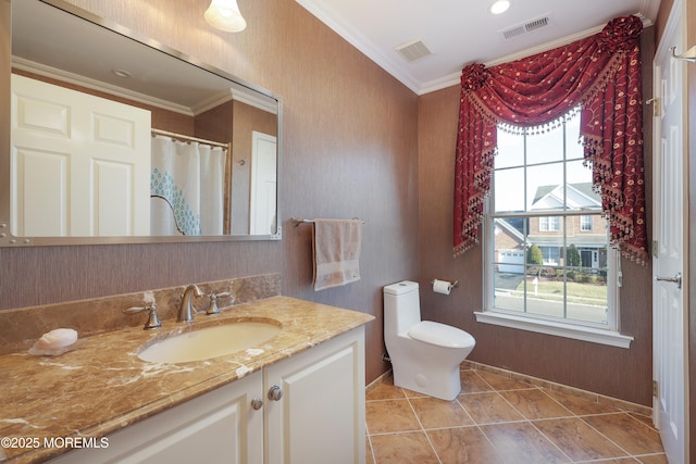 bathroom with toilet, ornamental molding, tile patterned flooring, and vanity