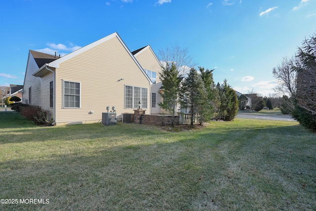 view of side of property with a lawn