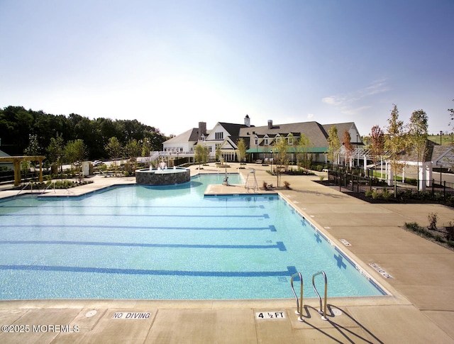 view of pool with a patio area