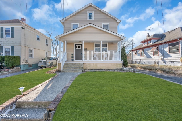 view of front facade featuring a front yard and a porch