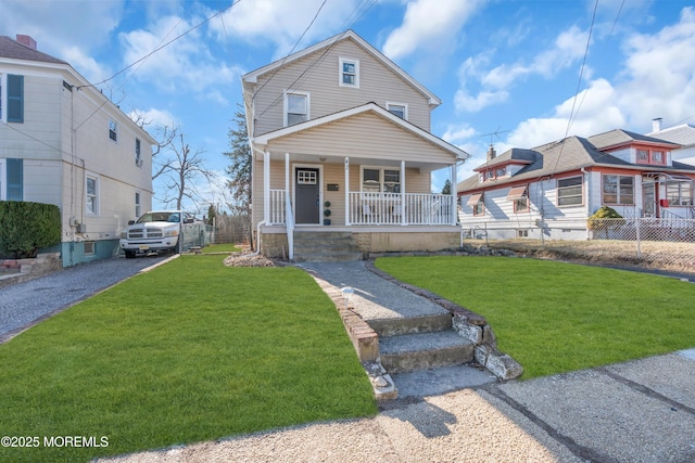 view of front property with a front lawn and a porch