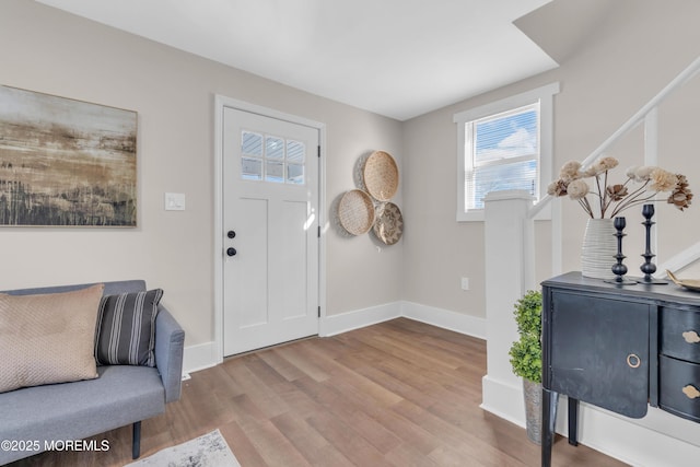 foyer entrance with wood-type flooring