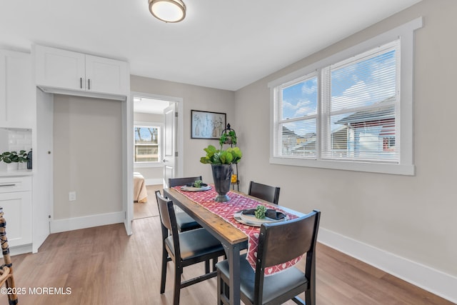 dining area featuring light wood-type flooring