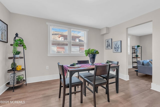 dining area with light wood-type flooring