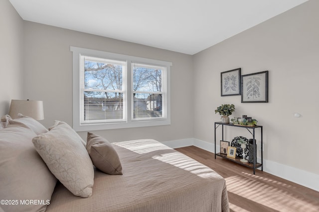 bedroom with hardwood / wood-style flooring