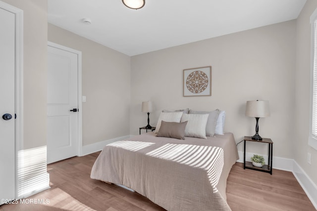 bedroom with light hardwood / wood-style floors