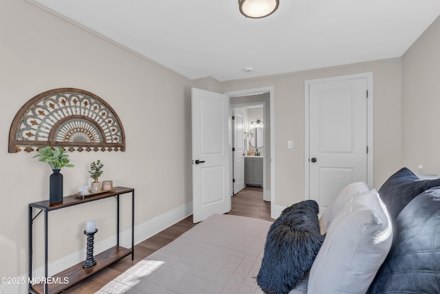 bedroom with dark hardwood / wood-style floors