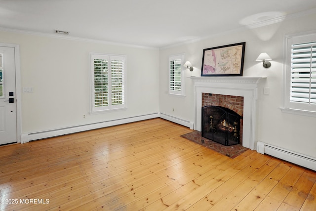 unfurnished living room with a baseboard heating unit, a brick fireplace, ornamental molding, and light hardwood / wood-style flooring