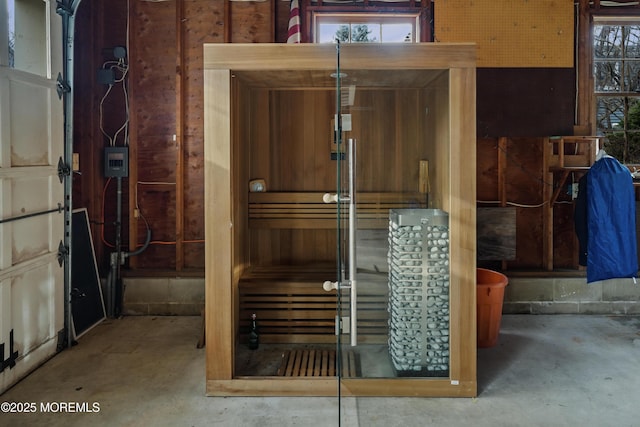 view of sauna featuring concrete floors