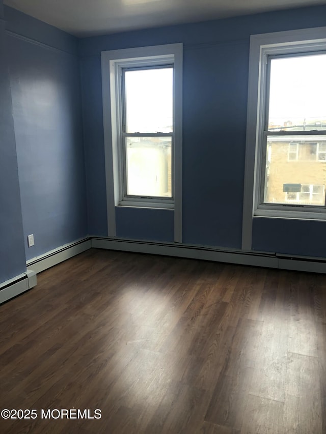 empty room with dark hardwood / wood-style floors