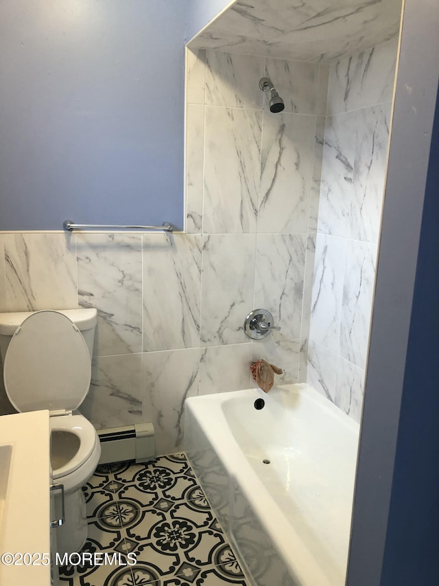 bathroom featuring toilet, shower / bathing tub combination, baseboard heating, tile walls, and tile patterned floors