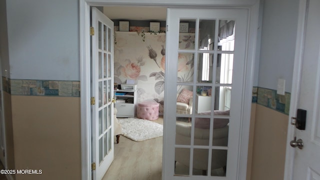 doorway to outside featuring french doors and hardwood / wood-style flooring