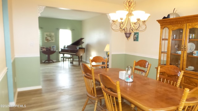 dining room featuring a chandelier and hardwood / wood-style flooring