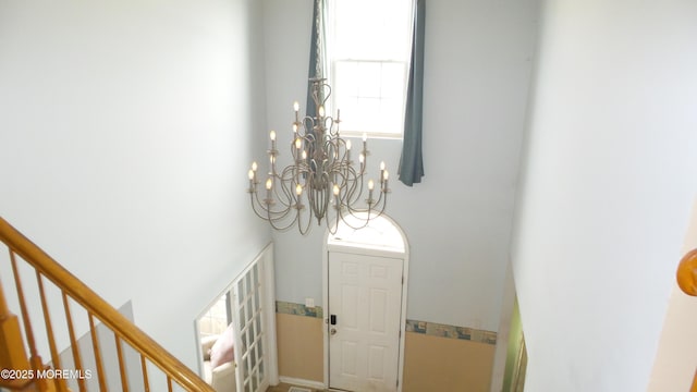 foyer with a notable chandelier