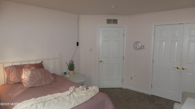 bedroom featuring a closet and carpet flooring