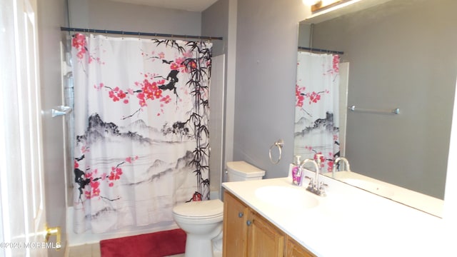 full bathroom featuring toilet, vanity, and shower / tub combo