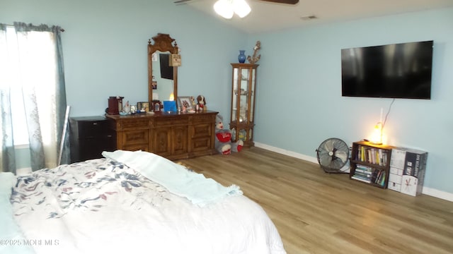 bedroom featuring ceiling fan and light wood-type flooring