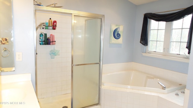 bathroom featuring separate shower and tub and sink