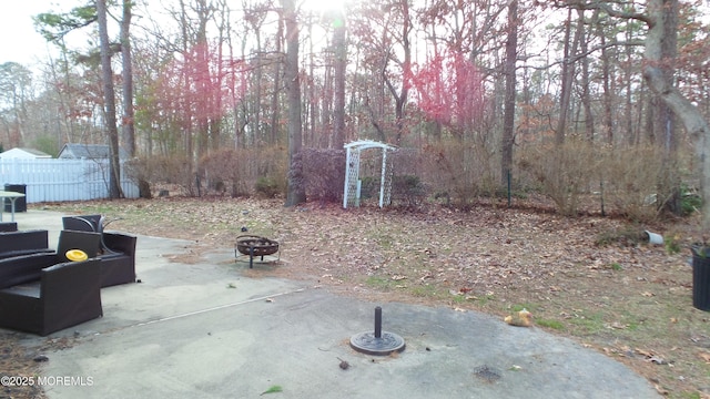 view of yard featuring a patio area and a fire pit