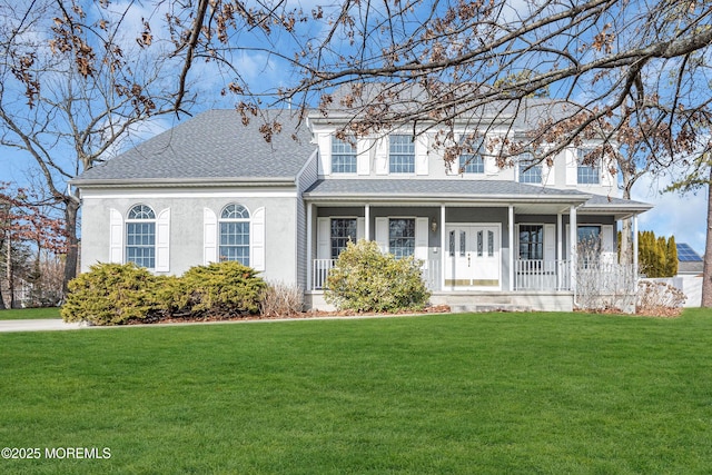 view of front of home with a porch and a front lawn