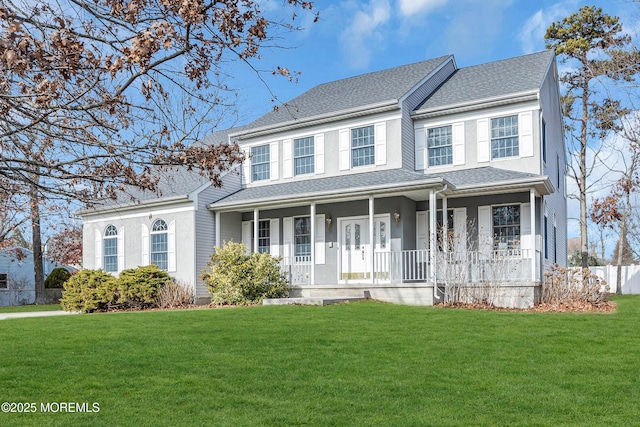 view of front of property with covered porch and a front lawn