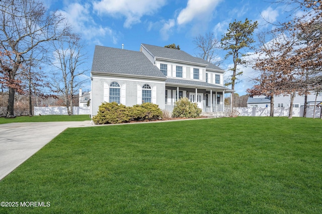 view of front of home featuring a front yard and covered porch