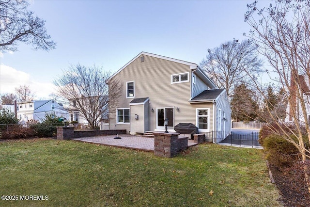 back of house with a patio area, a yard, and fence