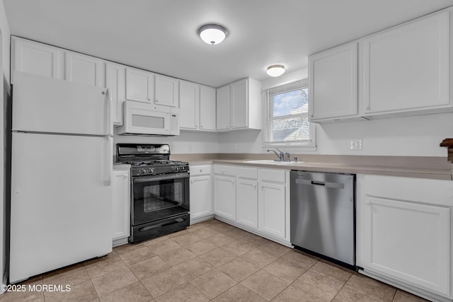 kitchen with sink, white cabinets, and white appliances