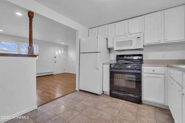 kitchen featuring light tile patterned floors, white cabinets, white appliances, and a baseboard heating unit