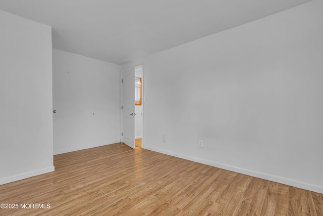 unfurnished room featuring light hardwood / wood-style flooring