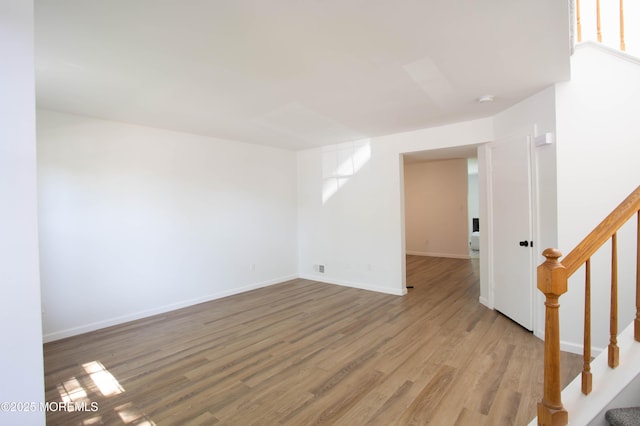 unfurnished room with light wood-type flooring