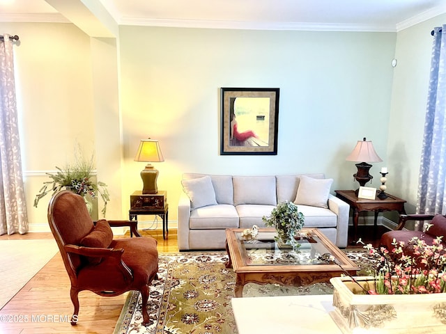 living room featuring light wood-type flooring and ornamental molding