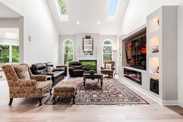 living room featuring high vaulted ceiling and hardwood / wood-style floors