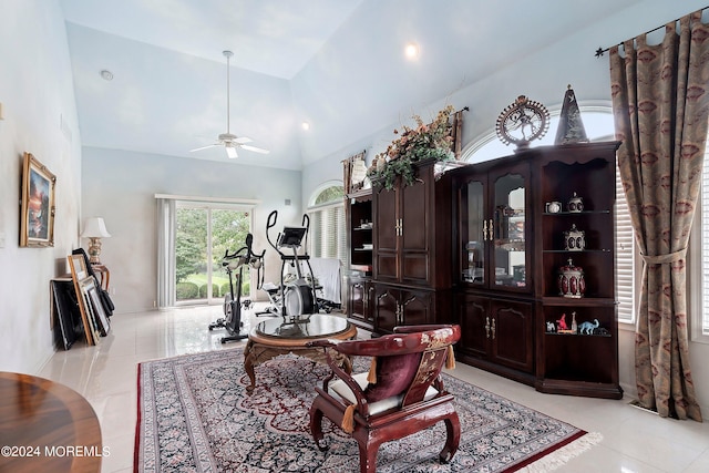 tiled office space featuring ceiling fan and vaulted ceiling