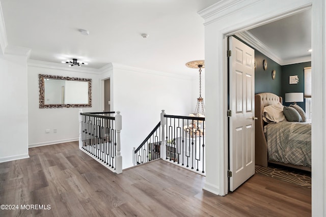 hall featuring crown molding and hardwood / wood-style flooring