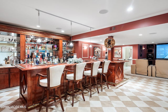 bar with hanging light fixtures