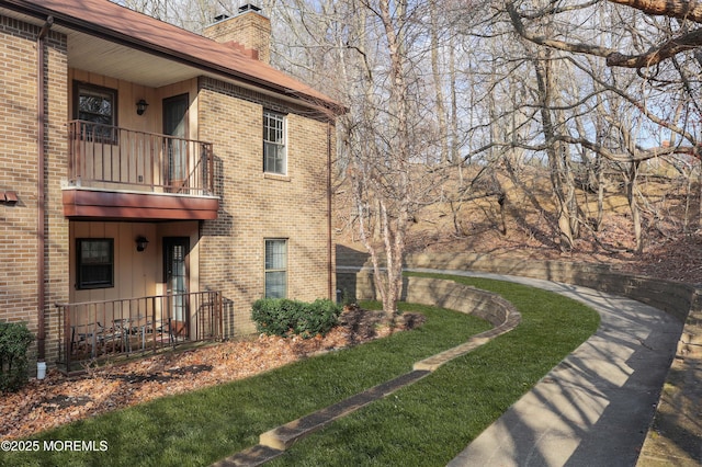 view of side of property featuring a balcony