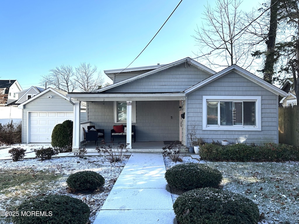 view of front of home featuring covered porch and a garage