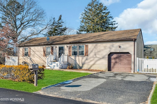 single story home with a front lawn and a garage