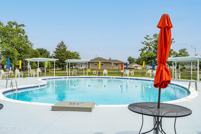 view of swimming pool with a patio