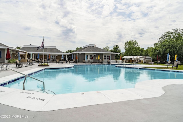 view of swimming pool with a patio area