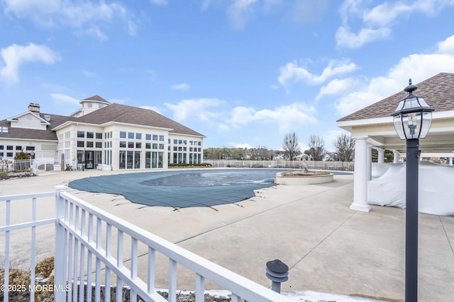 view of swimming pool featuring a patio area