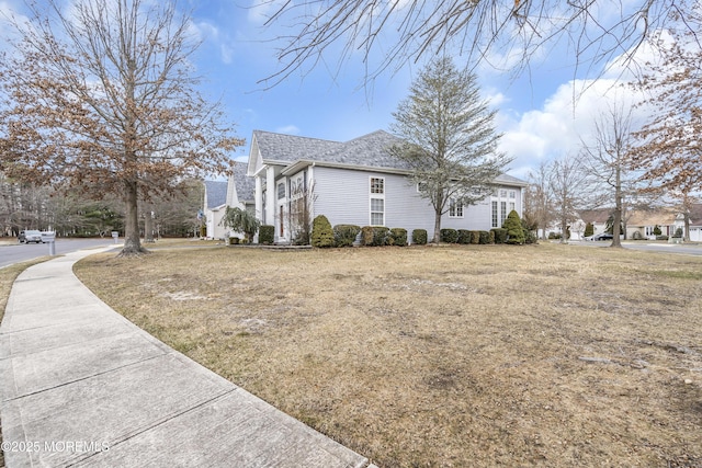 view of home's exterior featuring a yard