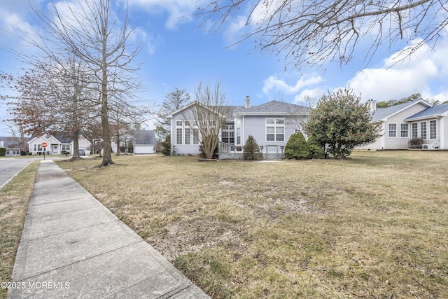 exterior space with a front lawn