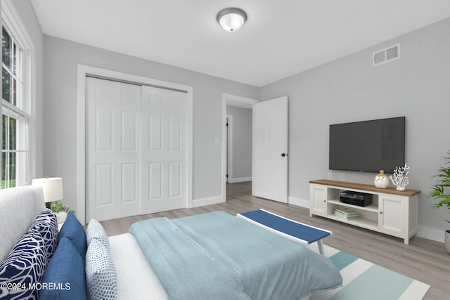 bedroom featuring a closet and light hardwood / wood-style flooring