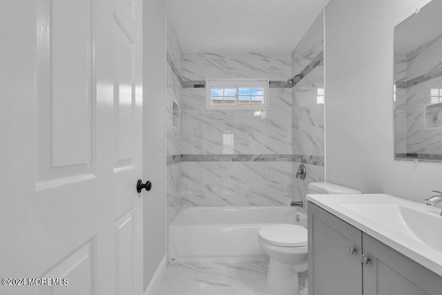 full bathroom featuring toilet, vanity, and tiled shower / bath combo