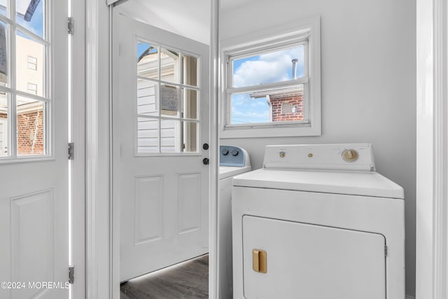 washroom featuring washing machine and dryer and plenty of natural light