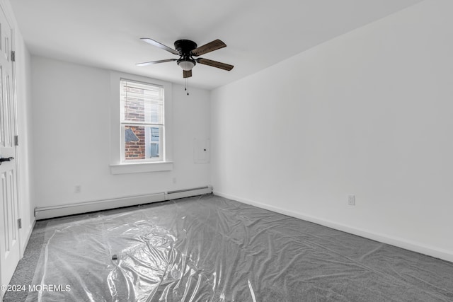 empty room with ceiling fan and baseboard heating