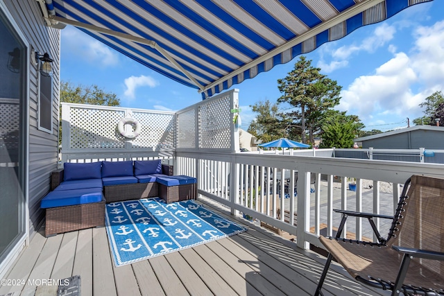 wooden deck featuring outdoor lounge area