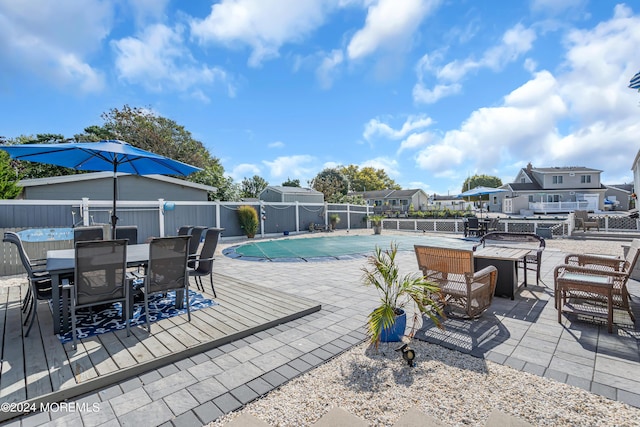 view of swimming pool featuring a patio area